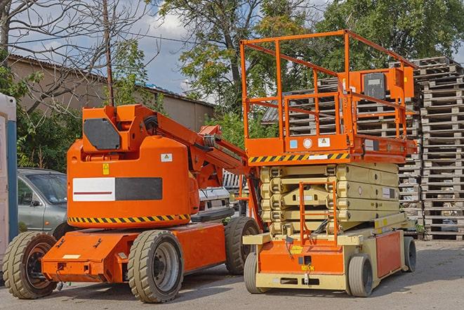 forklift driver organizing inventory in warehouse in Cardinal